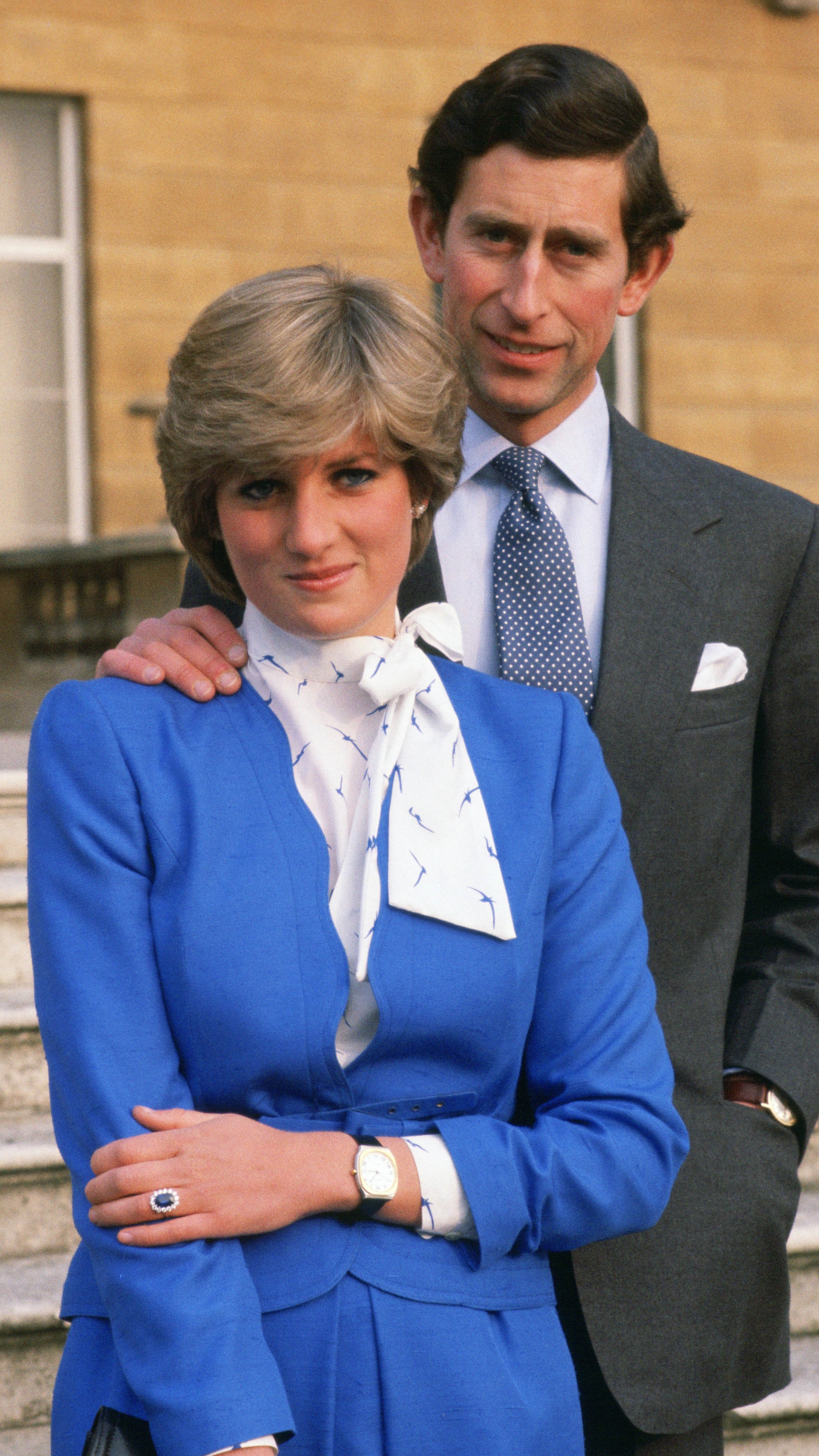 Princess Diana reveals her sapphire and diamond engagement ring while she and King Charles pose for photographs