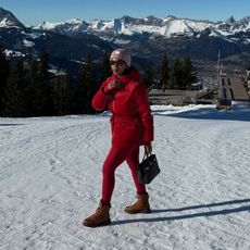 @nlmarilyn wearing a red matching ski set.