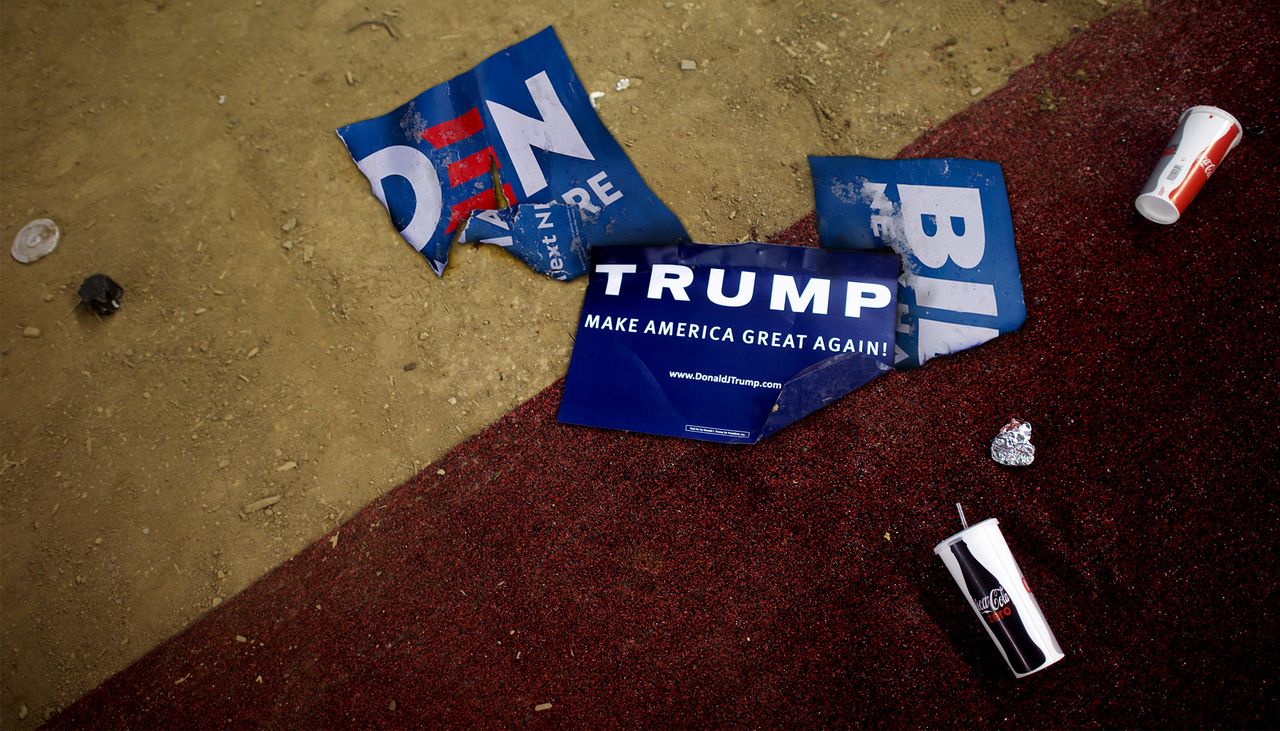 Joe Biden and Donald Trump signs on the ground.