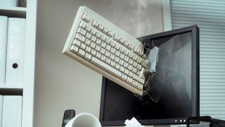 keyboard smashed through computer monitor
