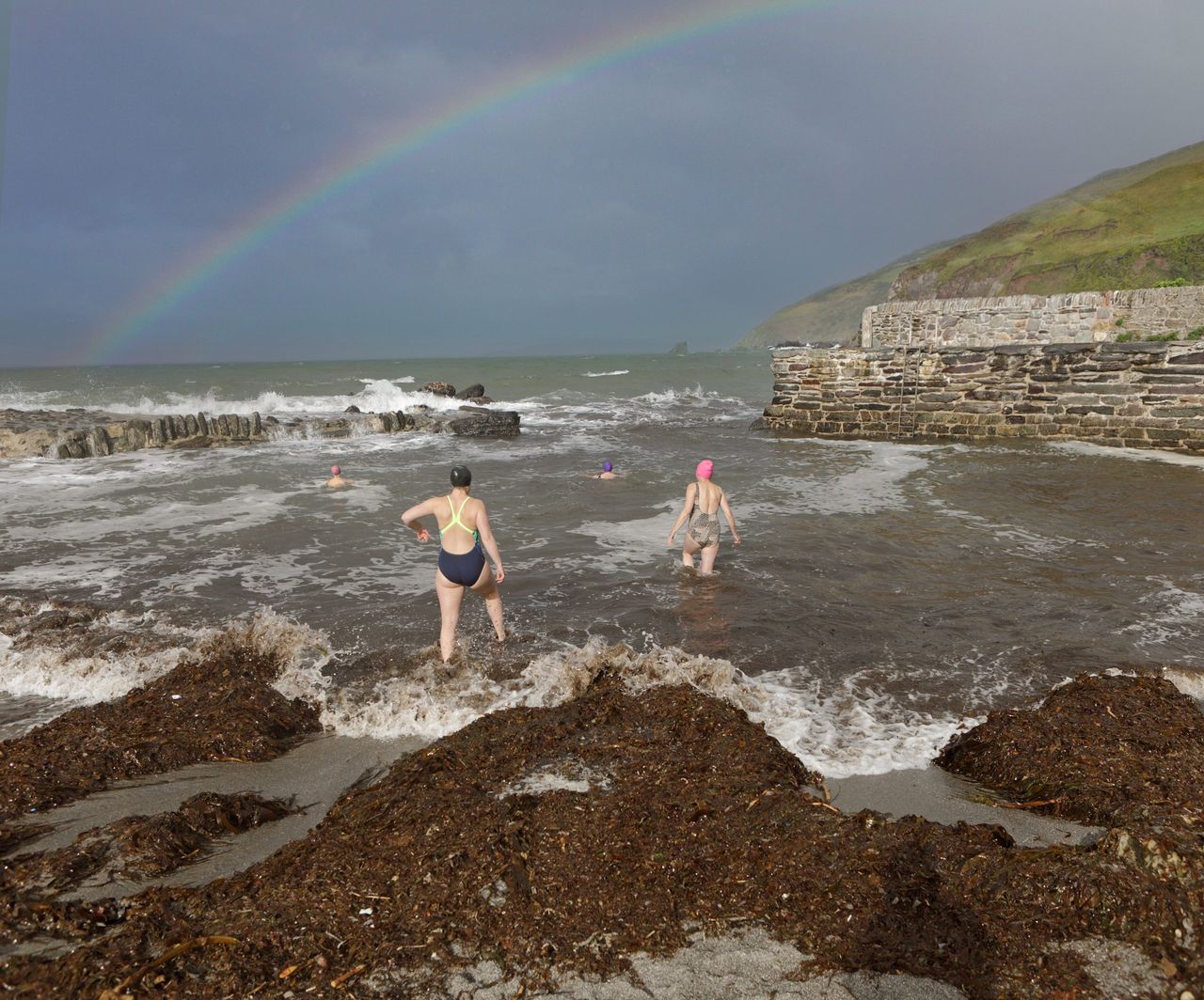 Fancy a dip? Heading into the chilly sea at Portwrinkle, Cornwall.