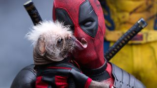 A close up shot of Dogpool being hugged by Deadpool in his third big-screen adventure