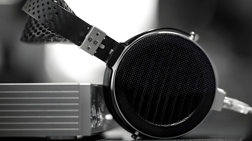 Moondrop Skyland headphones resting on their aluminium protective case