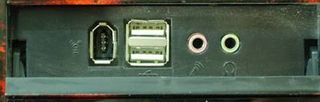 Open up the cover and here's 1 x firewire (IEEE 1394) and 2 x USB ports, as well as microphone and headphone jacks.