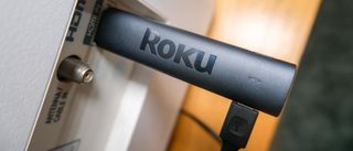 The Roku Streaming Stick 4K plugged into an HDMI port