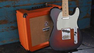 Fender Telecaster next to Orange amp