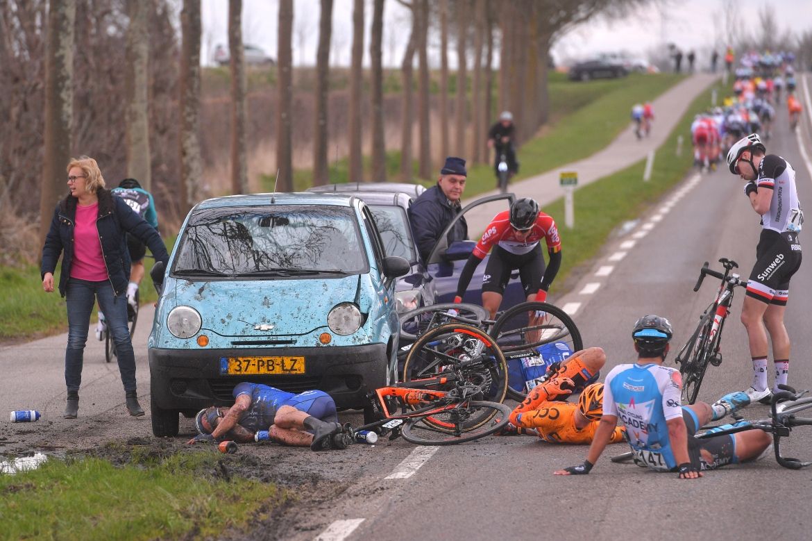 A crash involving a muddy ditch and a parked car ended the race for several riders