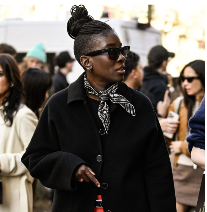 nikki ogunnaike wearing a scarf and a black jacket