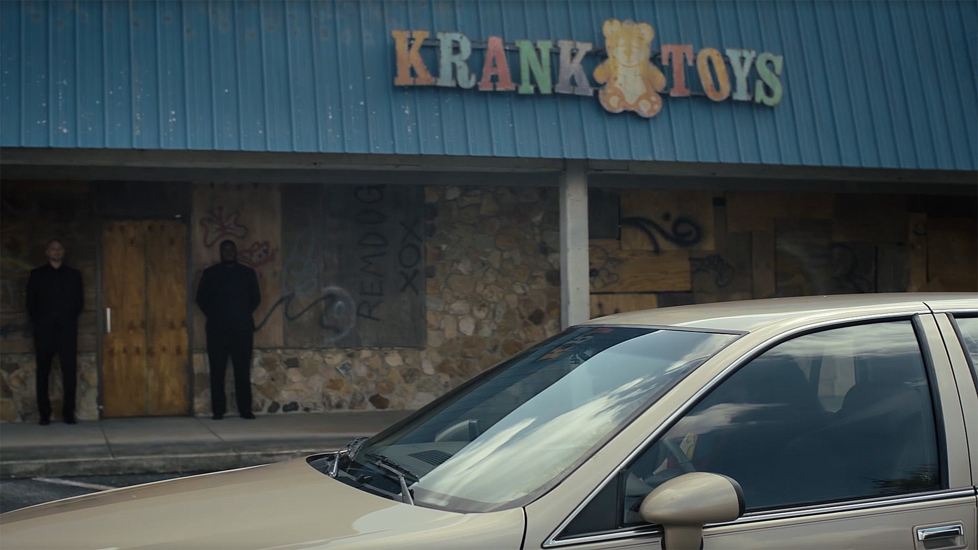 A car pulling up outside Krank Toys in Peacemaker season 2 episode 1