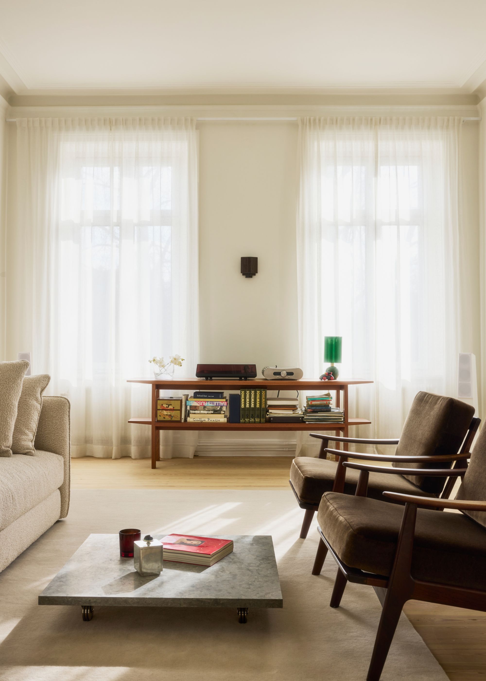 white living room with sheer linen curtains