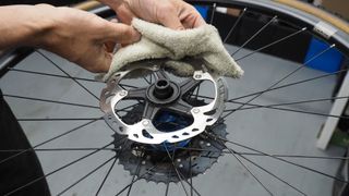 A brake rotor being cleaned