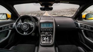 View of the interior and steering wheel of a jaguar f-type-coupe