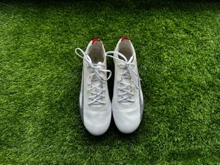 Sokito Scudetta football boots reviewed. The boots are placed on a piece of turf ahead of being reviewed.