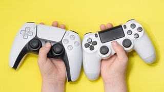 Child holding a PS5 and PS4 controller