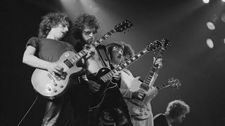 Blue Oyster Cult onstage, July 30, 1976. (from left) Allen Lanier, Eric Bloom, Buck Dharma, and Joe and Albert Bouchard