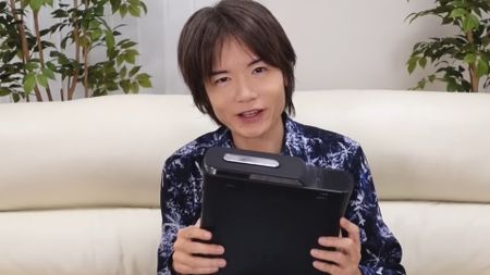 Masahiro Sakurai with his dead Xbox 360