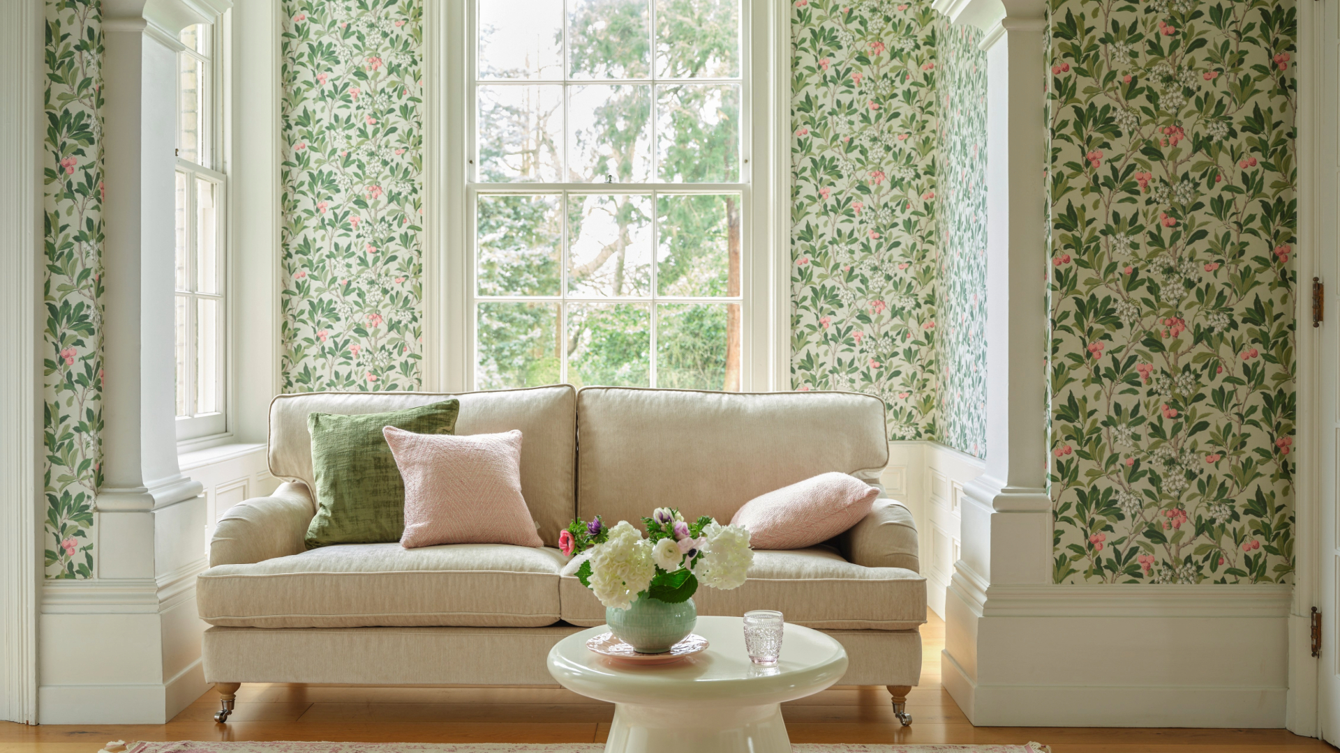Chintz wallpaper in living room with sofa
