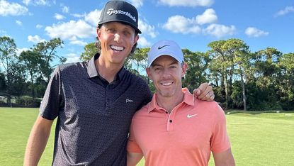 Grant Horvat stands beside Rory McIlroy