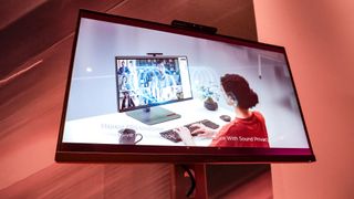 The new Lenovo ThinkCentre M90a Pro Gen 6 all-in-one PC with a video on screen showing off its in-display, private speakers