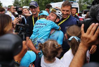 Mark Cavendish celebrates with his family after winning a record-breaking 35th stage win at the Tour de France