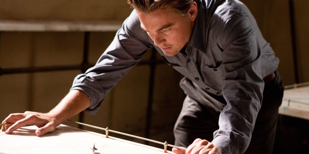 Leonardo DiCaprio stares at his spinning top in Inception.