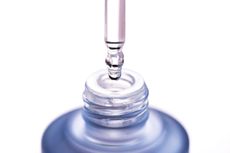 beta hydroxy acid main closeup image of dropper with clear serum