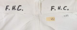 Francis Crick's initials on the inside collar of his lab coat.