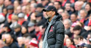 Liverpool manager Jurgen Klopp looks disconcerted after Arsenal score the opening goal during the Premier League match between Liverpool FC and Arsenal FC at Anfield on April 9, 2023 in Liverpool, United Kingdom. 