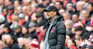 Liverpool manager Jurgen Klopp looks disconcerted after Arsenal score the opening goal during the Premier League match between Liverpool FC and Arsenal FC at Anfield on April 9, 2023 in Liverpool, United Kingdom.