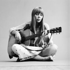 Joni Mitchell playing guitar 