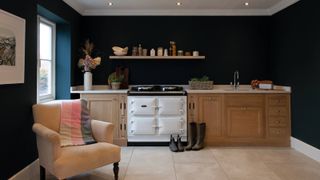 white AGA in wooden kitchen with stone floor