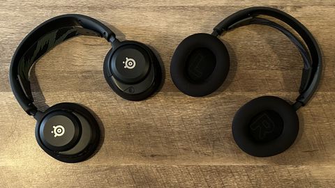 SteelSeries Arctis Nova 4 and 4X headsets on a wooden table