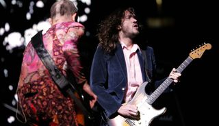 Flea (left) and John Frusciante of the Red Hot Chili Peppers perform at the Continental Airlines Arena on October 17, 2006