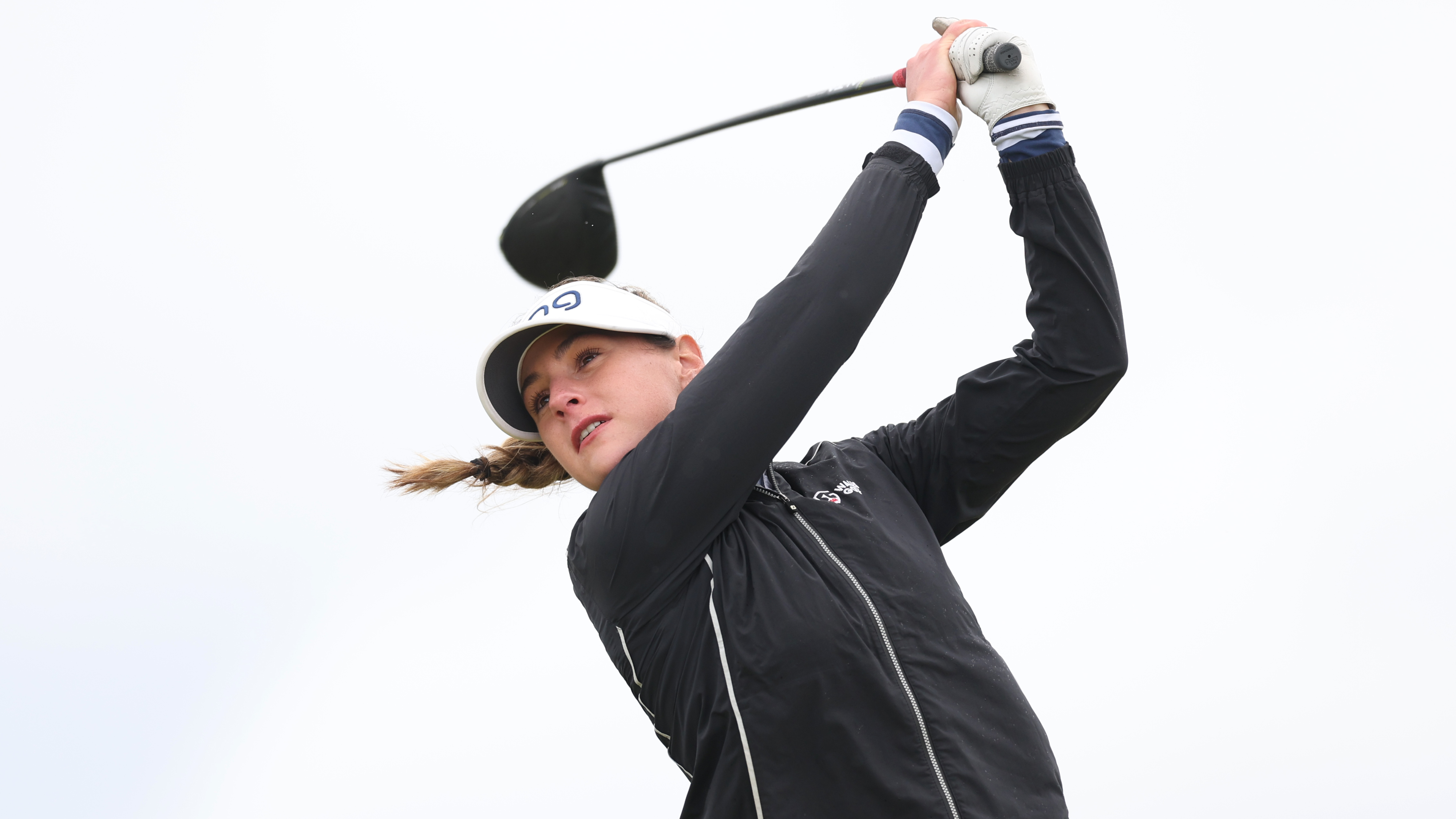 Darcey Harry holding her pose after hitting a drive