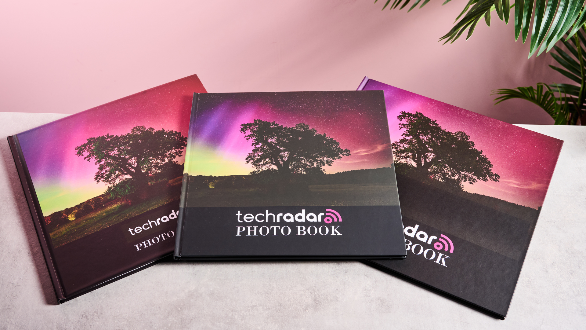 From left to right, the Shutterfly, Snapfish, and Mixbook photo books are arranged to show how much darker the Snapfish front cover is.