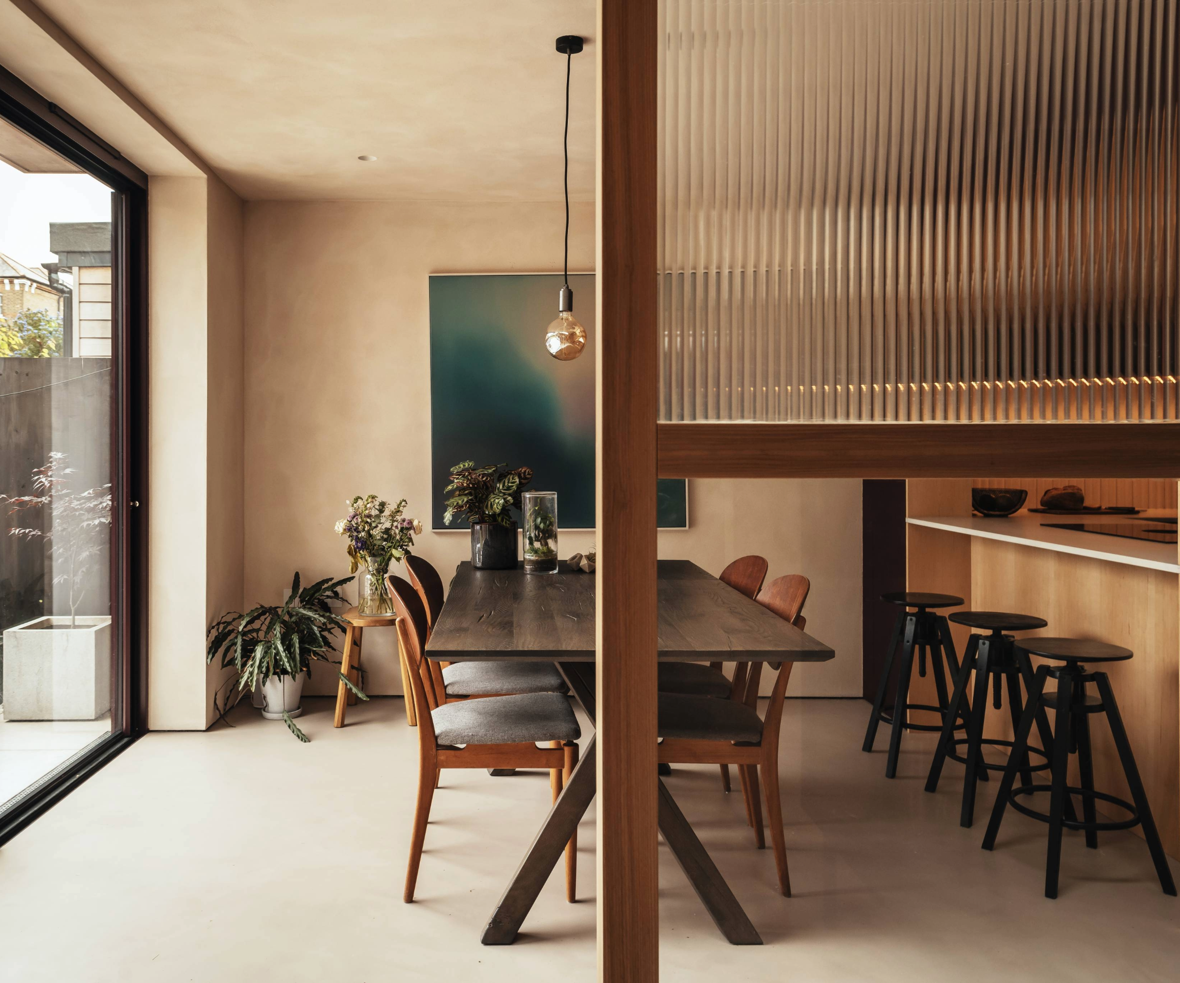 Open plan kitchen diner with large patio door windows
