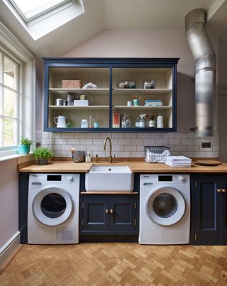 a laundry room with a rooflight and window