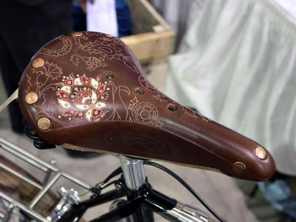 Brooks makes the saddle but the artwork comes courtesy of Kara Ginther Leather.