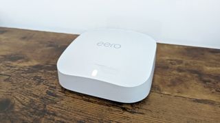 Amazon Eero Pro 6E review: mesh wi-fi router on wooden desk