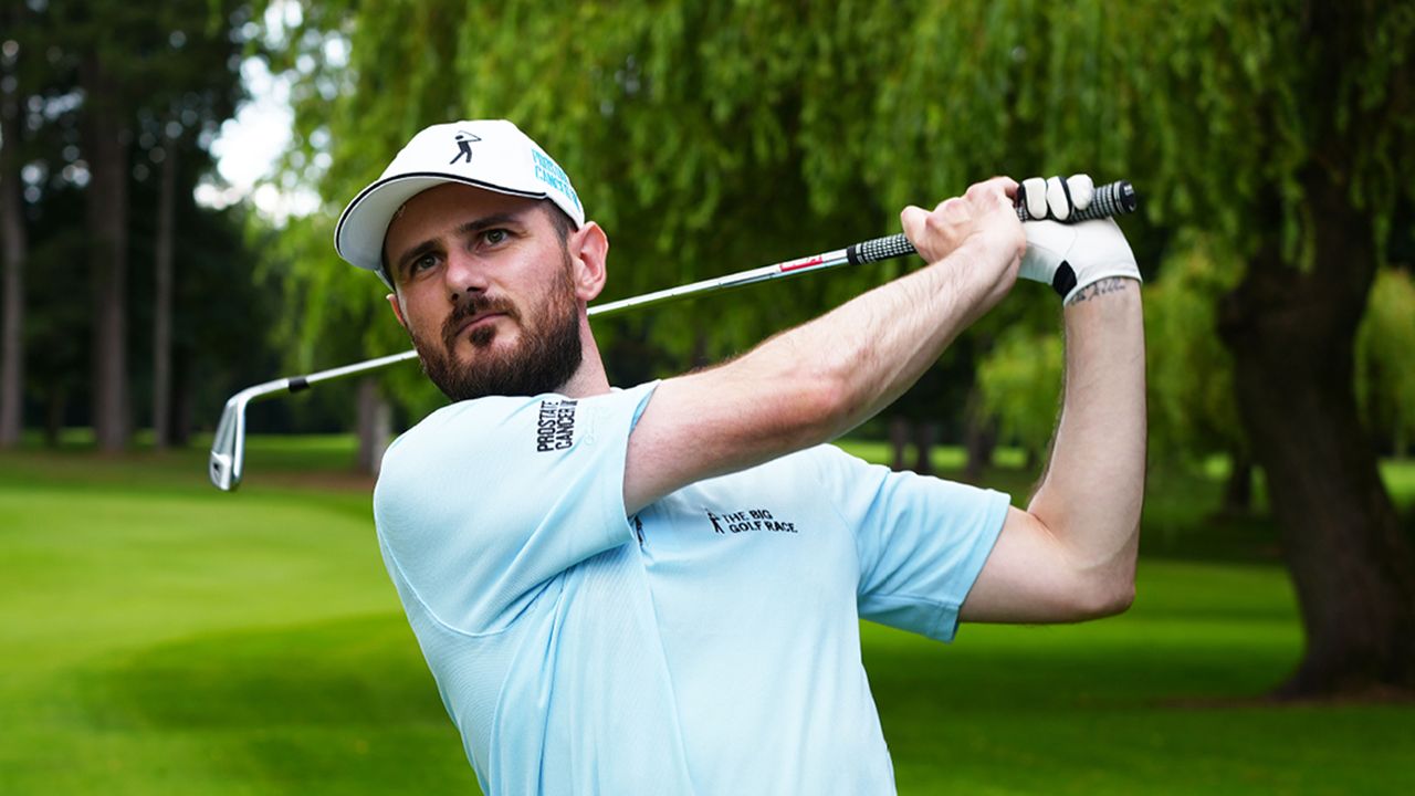 Barry Plummer holds a post-shot pose wearing The Big Golf Race polo and cap