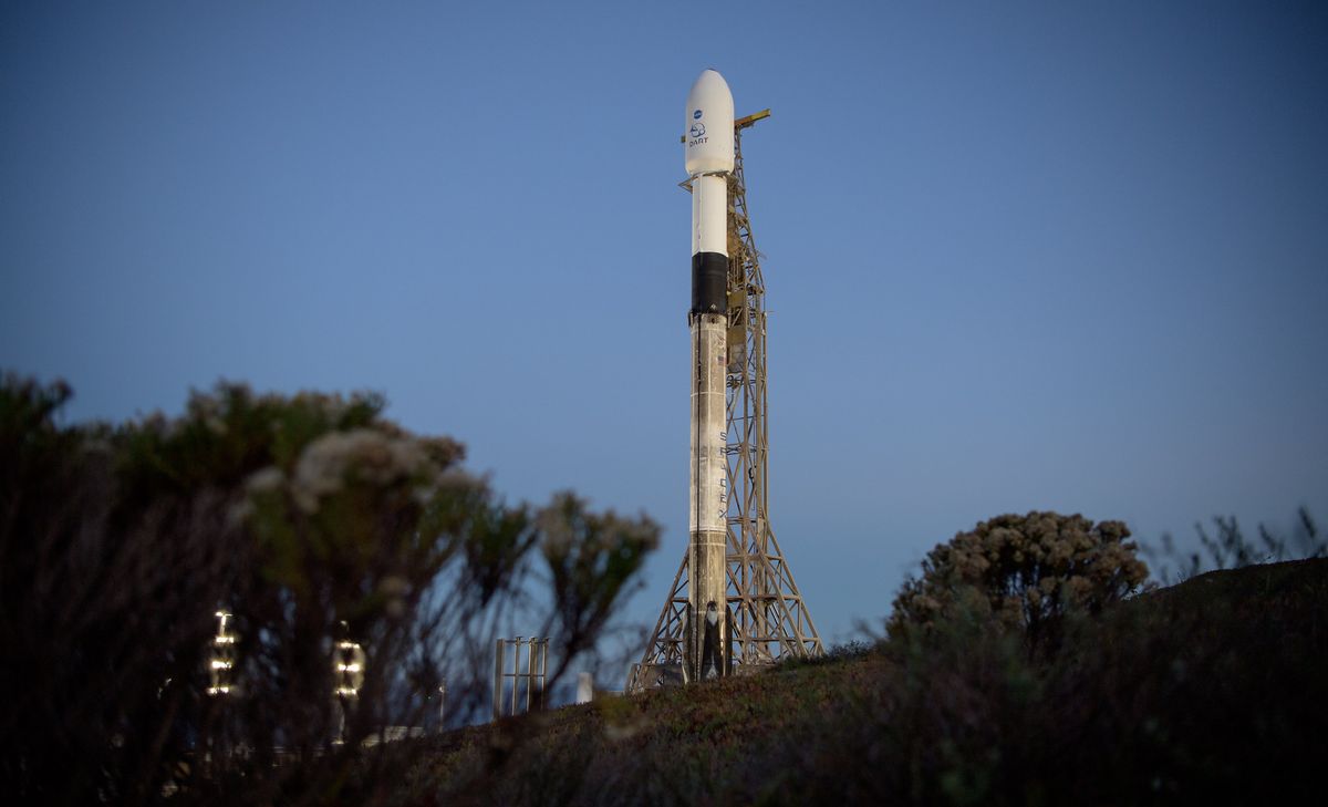 The SpaceX Falcon 9 rocket with the Double Asteroid Redirection Test (DART) spacecraft onboard is seen during sunrise at Vandenberg Space Force Base in California, on Nov. 23, 2021.