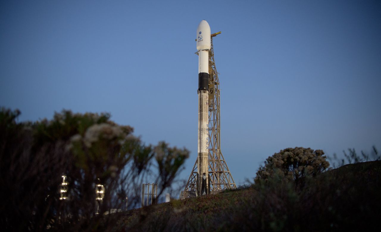 The SpaceX Falcon 9 rocket with the Double Asteroid Redirection Test (DART) spacecraft onboard is seen during sunrise at Vandenberg Space Force Base in California, on Nov. 23, 2021.