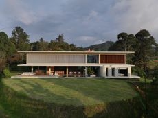 casa cuore exterior, concrete geometric forms among greenery