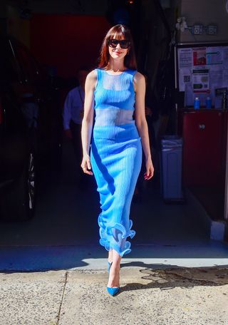 Anne Hathaway wearing a blue semi sheer set to promote The Idea of You in New York City