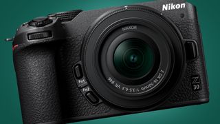 The Nikon Z30 camera on a green background