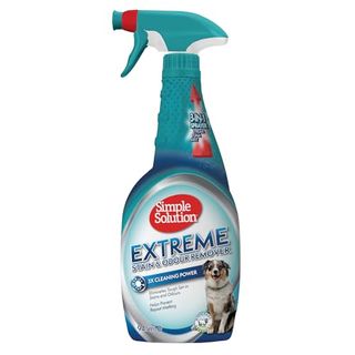 Green spray bottle of Simple Solution Extreme Pet Stain and Odor Eliminator Spray, Enzymatic Cleaner With 3x Pro-Bacteria Cleaning Power for Dogs & Cats, with a label on the front showing a white and brown