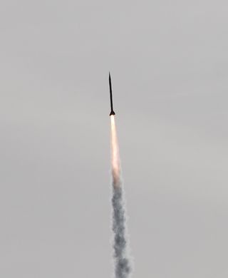 An UP Aerospace rocket speeds to a new altitude record over New Mexico’s Spaceport America on April 5, 2012.