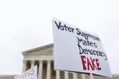 Protest sign outside SCOTUS