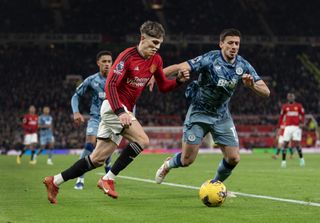Alejandro Garnacho of Manchester United and Clement Lenglet of Aston Villa in action during the Premier League match between Manchester United and Aston Villa at Old Trafford