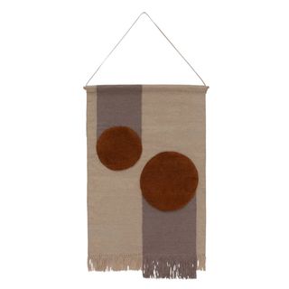 A wall tapestry in autumnal colors